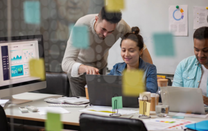 man and woman working on a laptop together